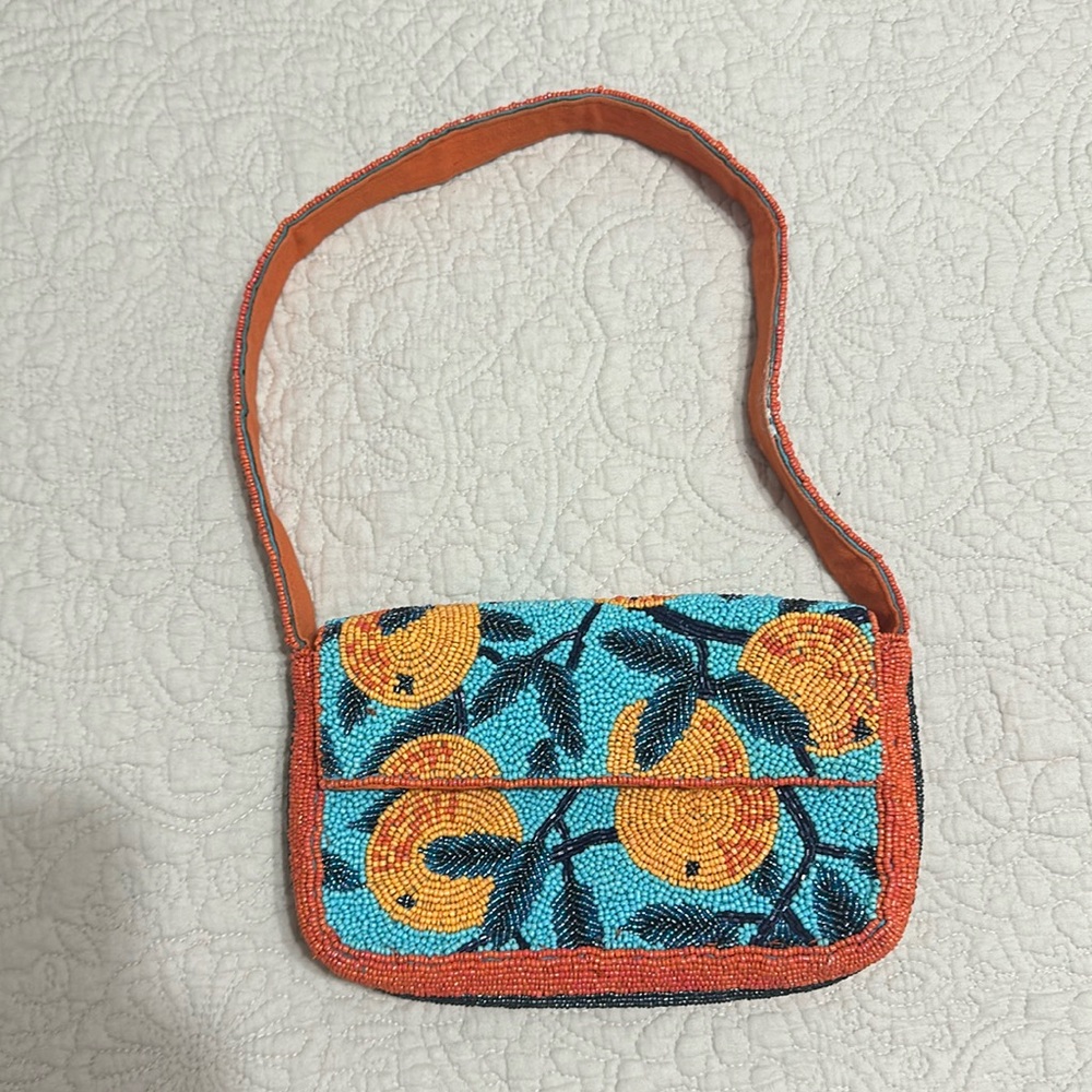 Anthropologie beaded bag in oranges pattern